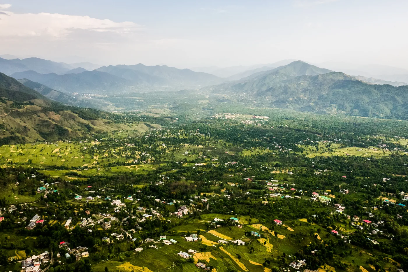 The Kangra valley from the air, villages and fields below the hills